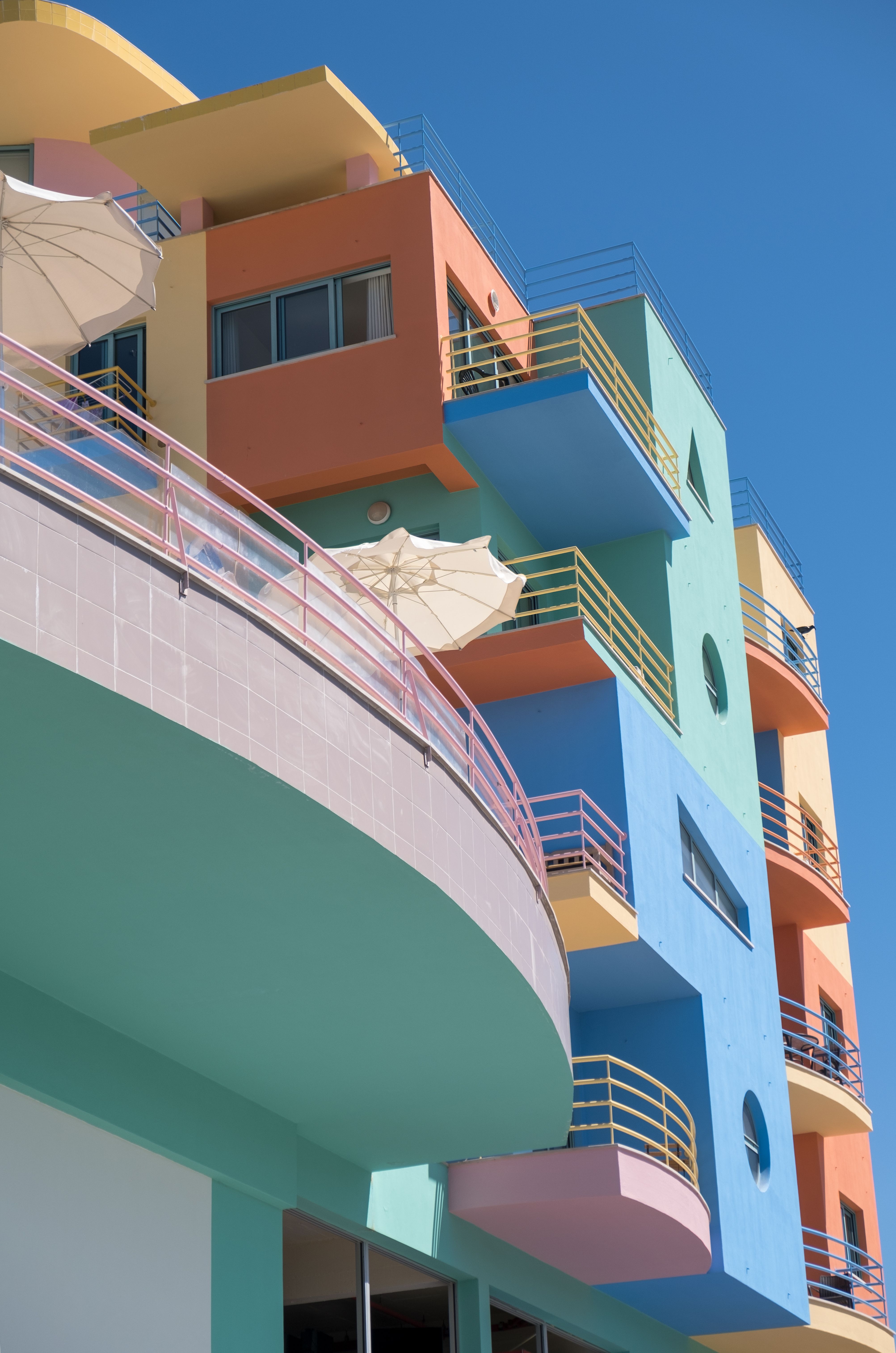 Colorful modernist architecture beneath a deep blue sky